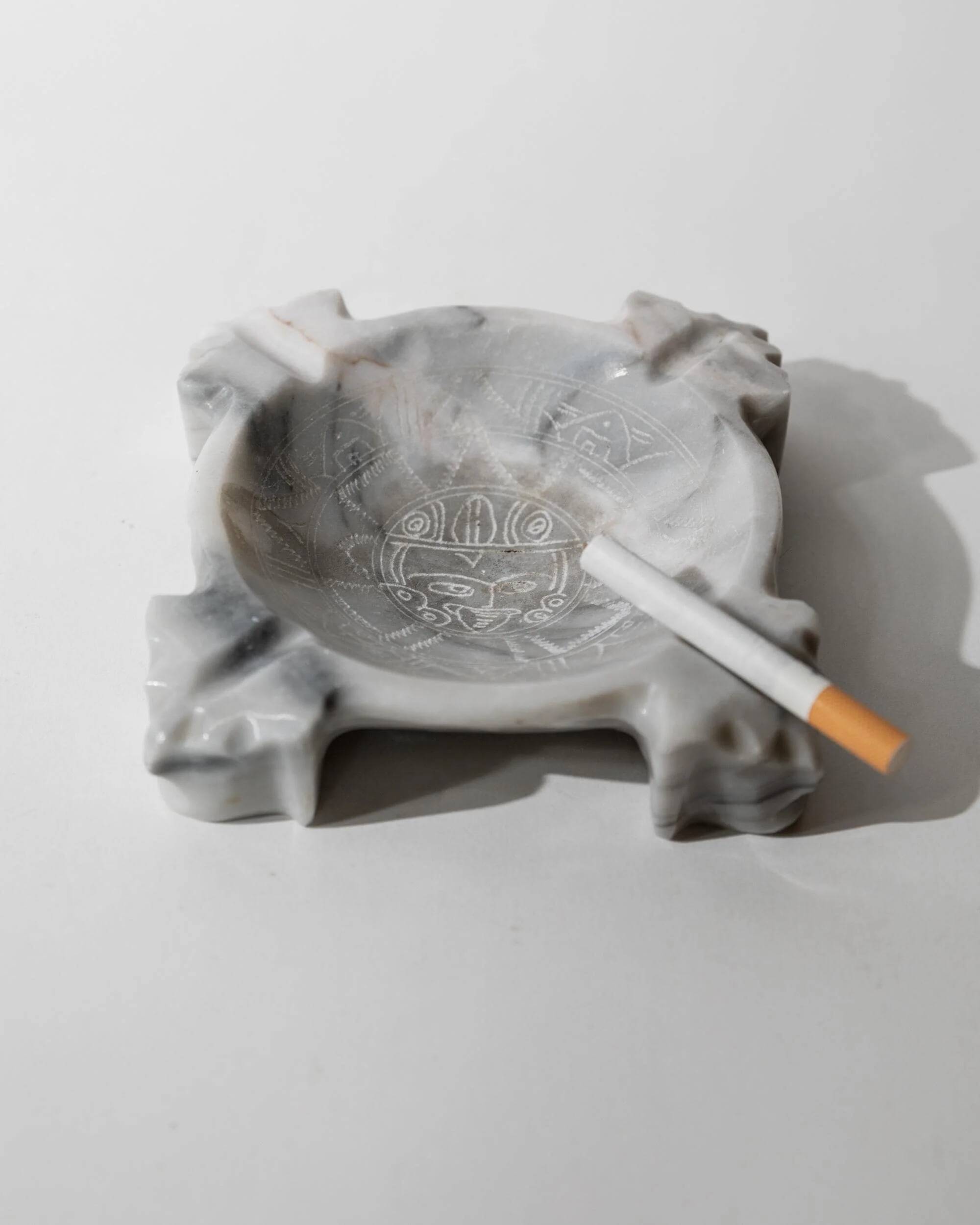 Vintage Mexican marble ashtray from the 1970s, engraved Aztec pattern.