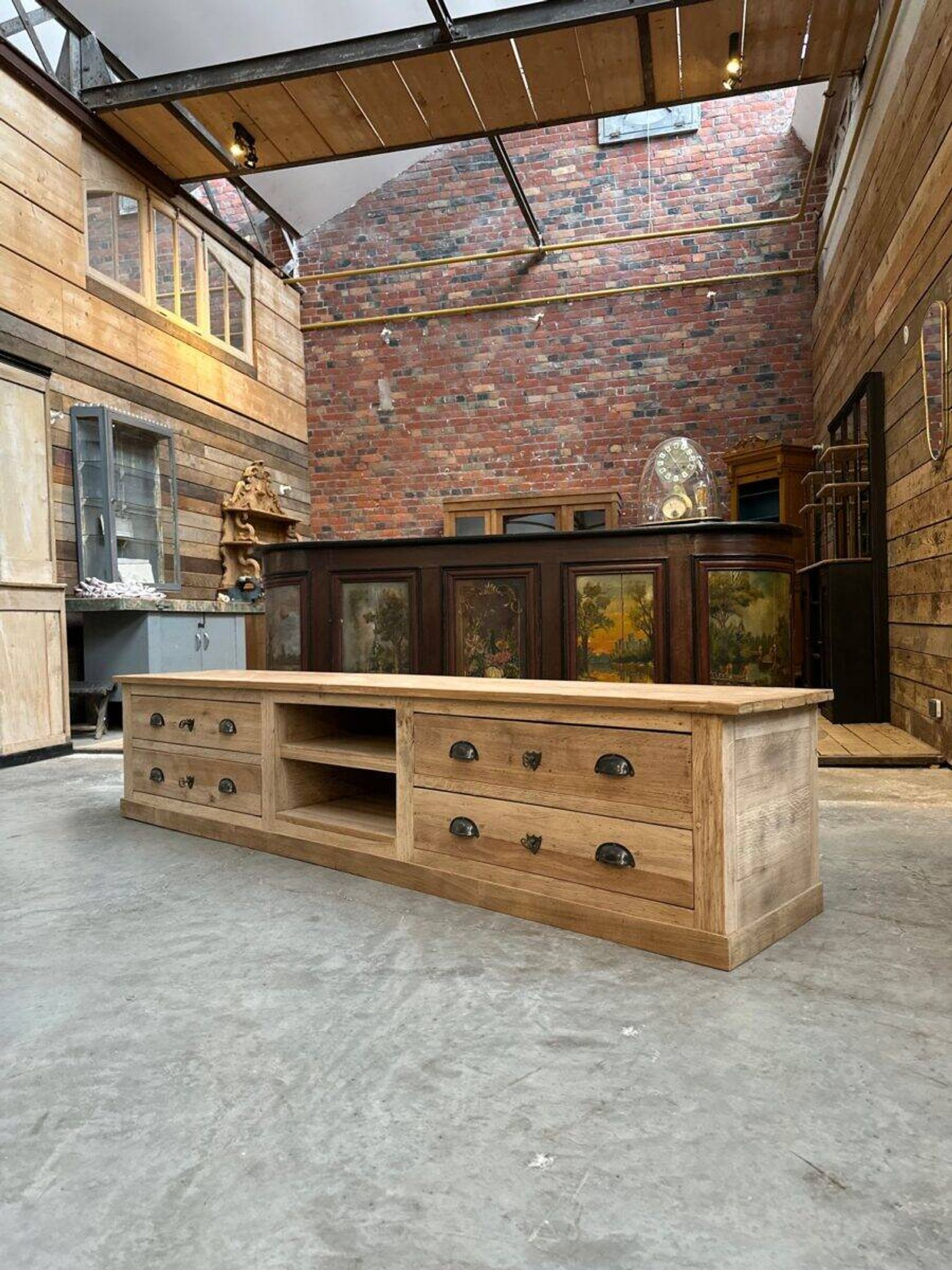An old piece of workshop furniture transformed into a TV stand