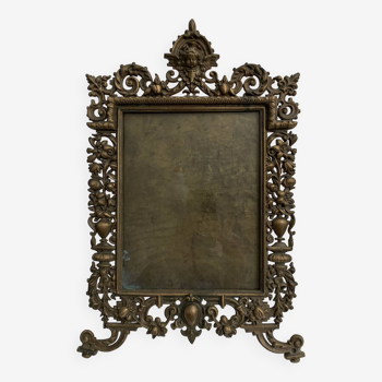 Old bronze photo frame decorated with a 19th century cherub