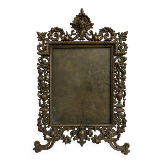 Old bronze photo frame decorated with a 19th century cherub