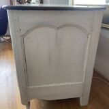 Patinated crossbow chest of drawers.