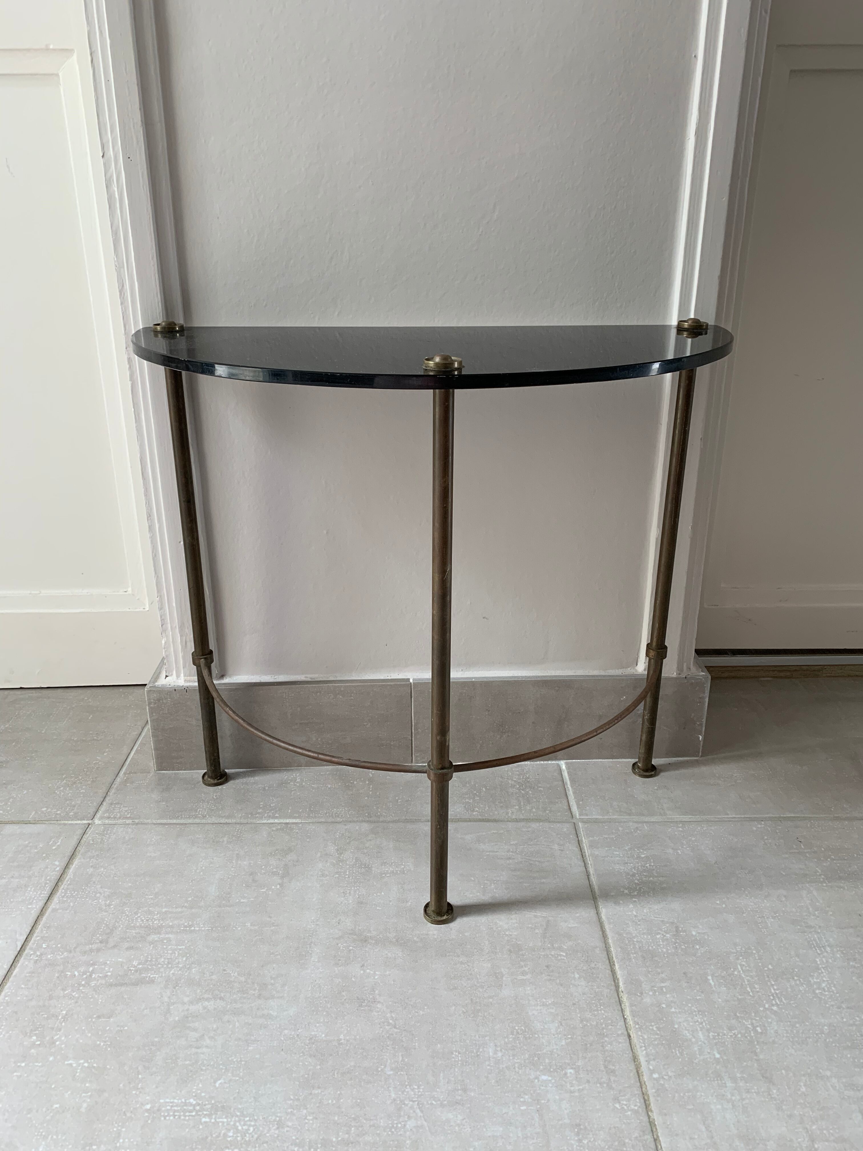 Half-moon console in glass and brass