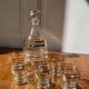 Gold-rimmed decanter and liqueur glass service