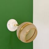 Vintage globe wall light in frosted yellow and gold glass.