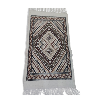 White carpet with multicolored Berber patterns handmade