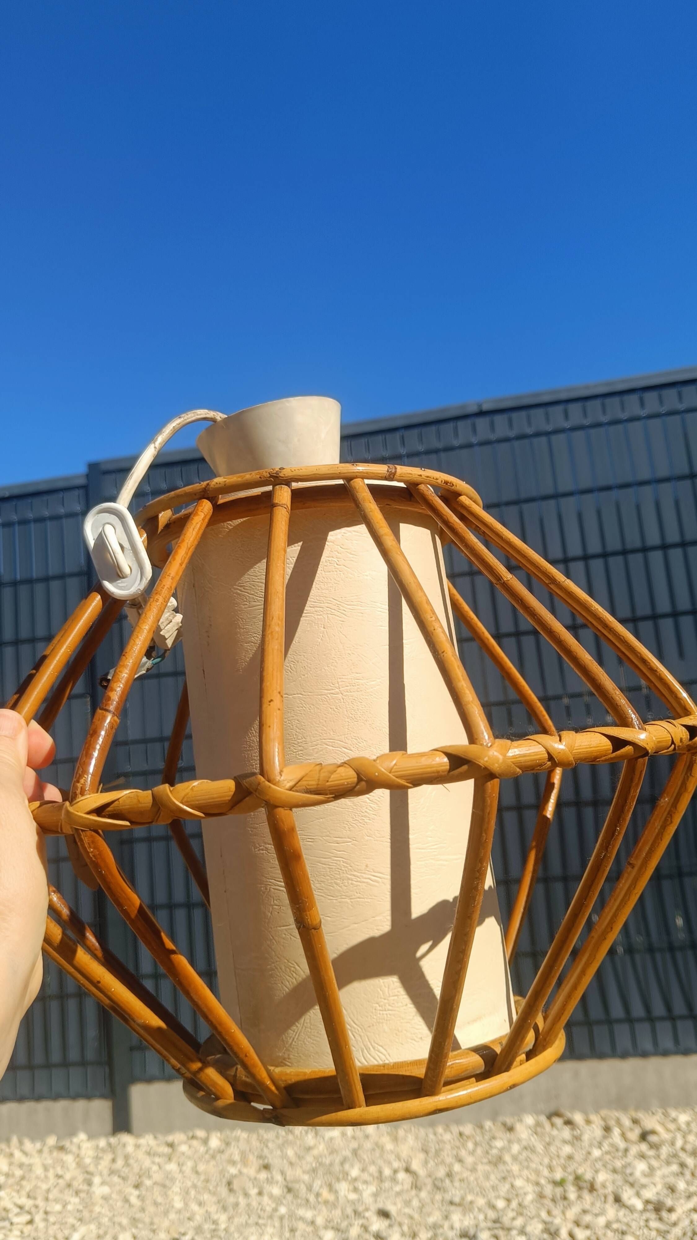 Vintage rattan and bamboo pendant light with removable shade.