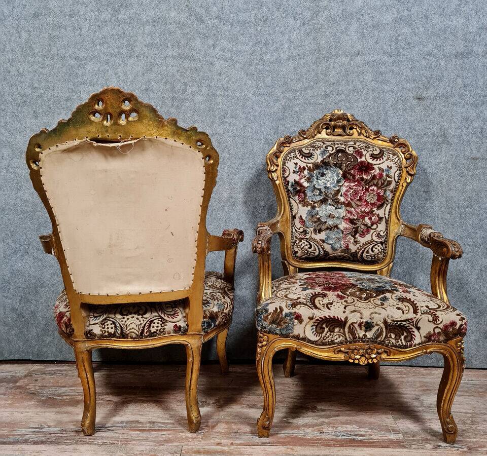 Pair of Louis XV style Baroque armchairs in gilded and carved wood circa 1900