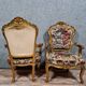 Pair of Louis XV style Baroque armchairs in gilded and carved wood circa 1900