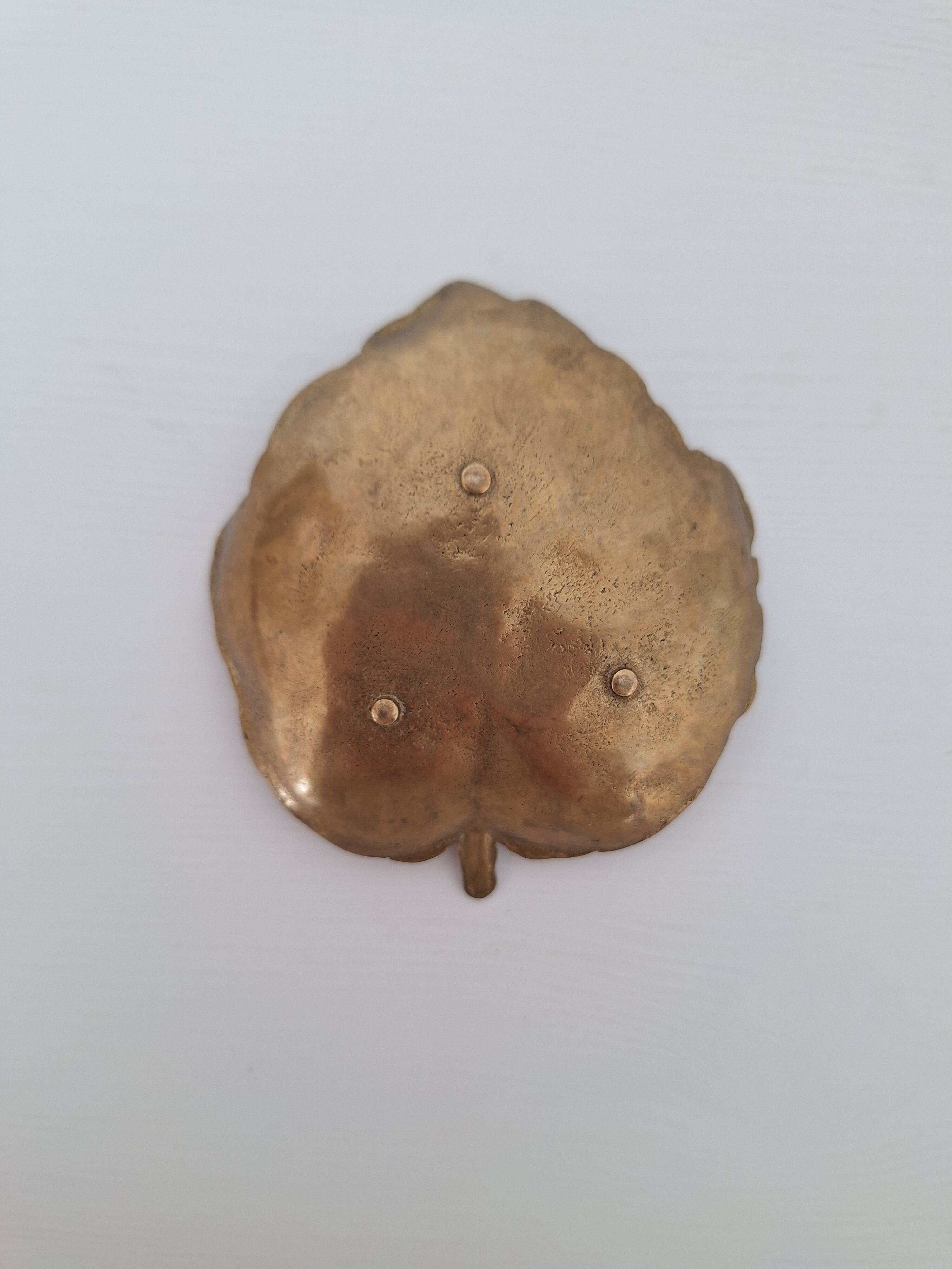 Vintage brass pocket emptier