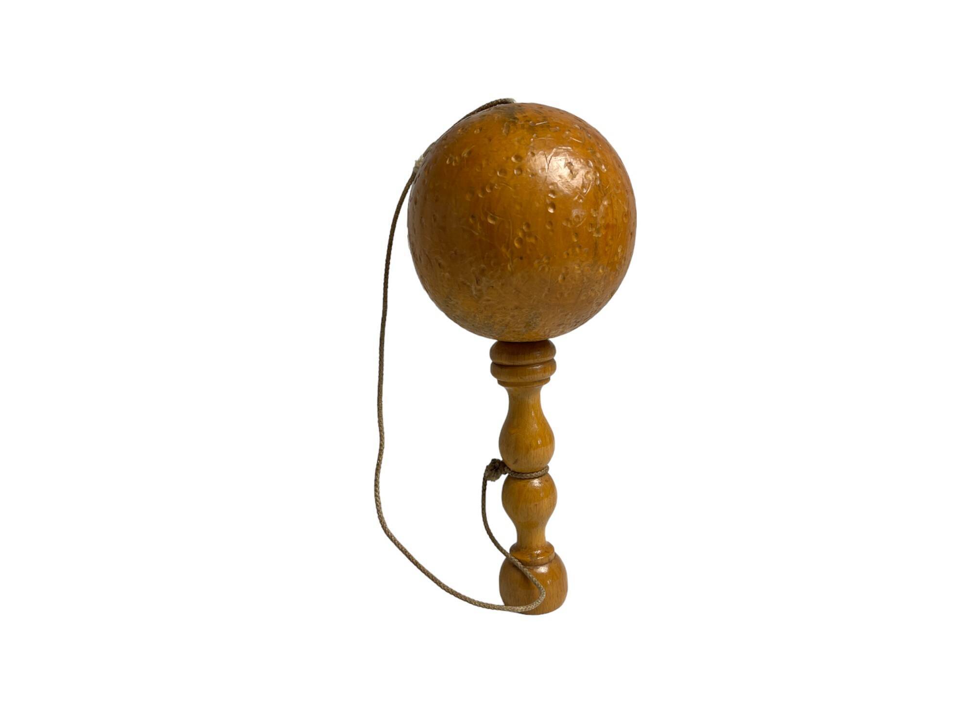 Old bilboquet toy in varnished wood 20th century