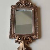 Louis XVI/Baroque style rectangular mirror. In polyresin with golden patina/Cérusée. Fronton knot. Dim. 47 x 14 cm