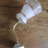Apply brass swan collar and glass graphic patterns
