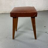Small stool or footrest in wood and leather