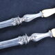 Salad serving set in antique ivory, silver-plated handle.