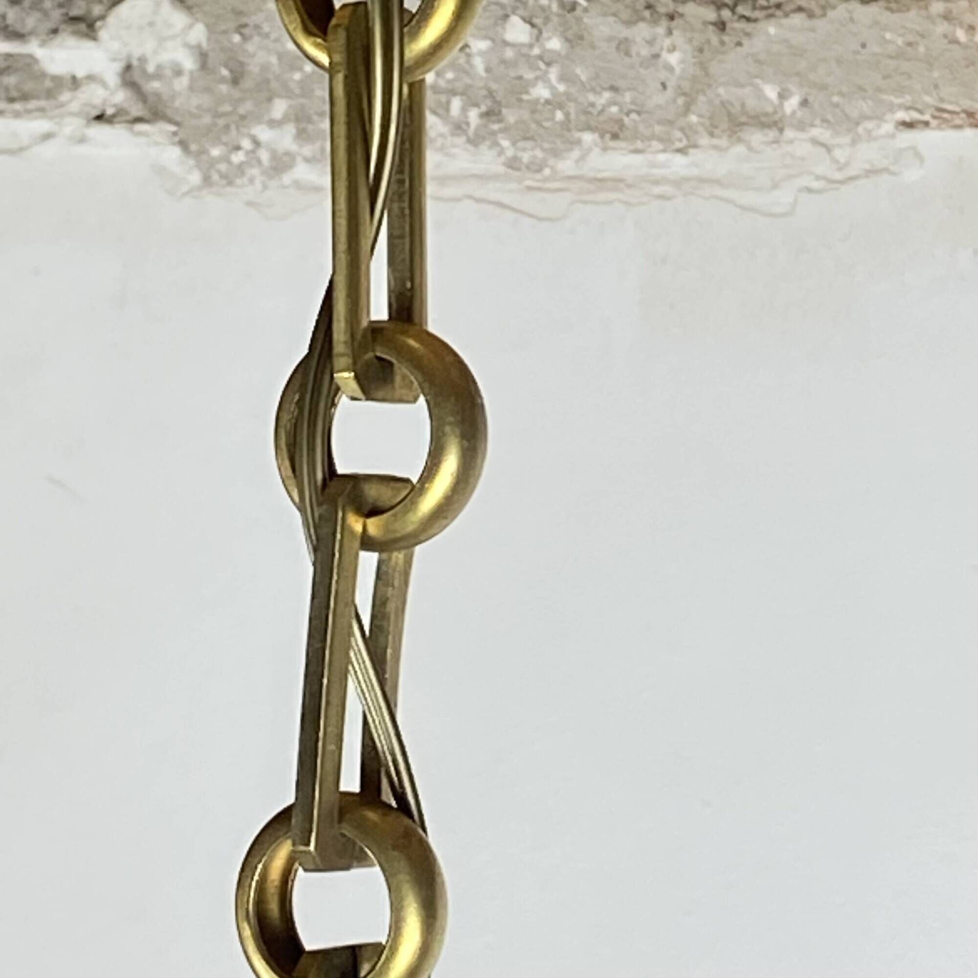 Suspension in white opaline glass and brass 1920 with a gilded brass chain.