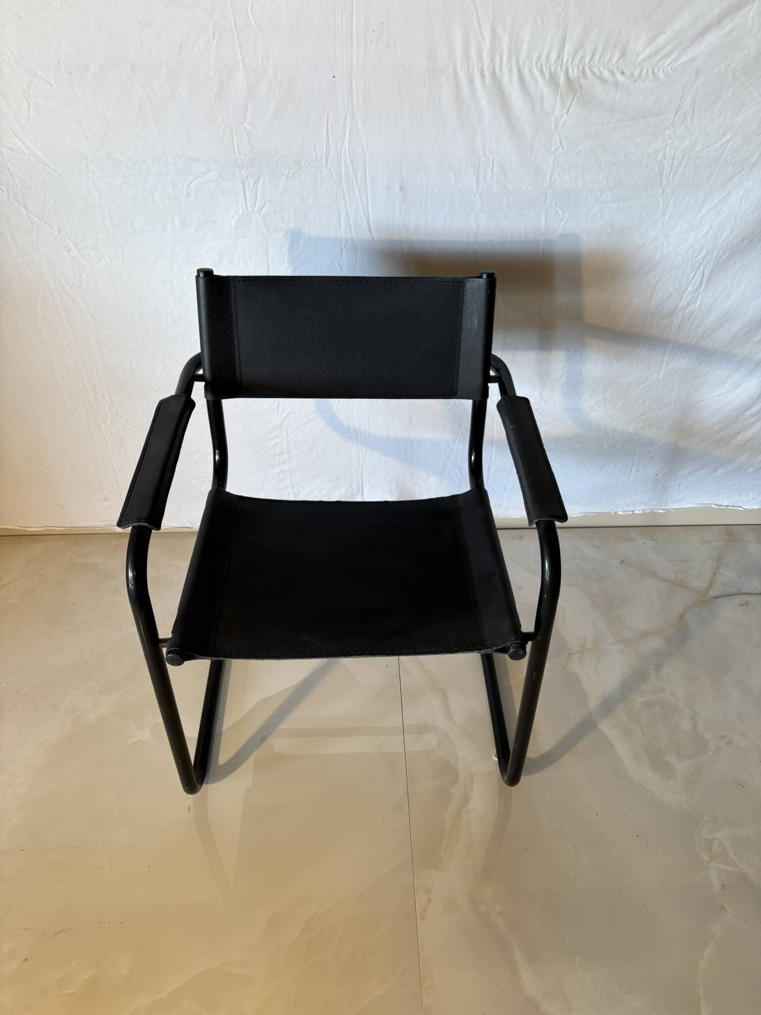 Set of 12 vintage black leather and tubular steel chairs – Italy, year