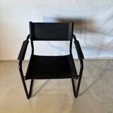 Set of 12 vintage chairs in black leather and tubular steel – Italy, 1970s