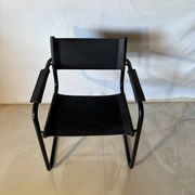 Set of 12 vintage black leather and tubular steel chairs – Italy, year