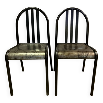 Two vintage slatted chairs.