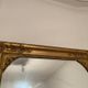 Nineteenth century mirror in wood and stucco gilded with rich gold leaf ornamentation, 101x127 cm