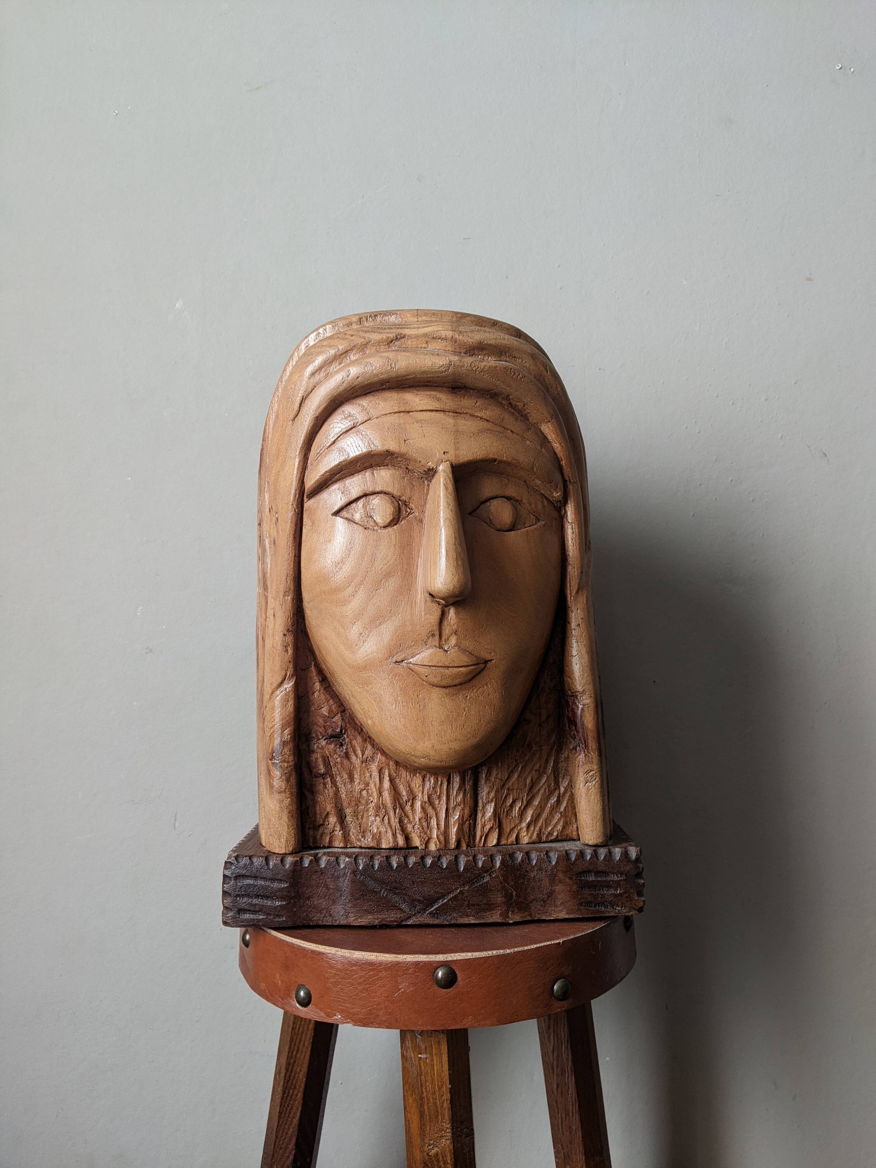 Handcrafted sculpture of the head of Christ in elm.