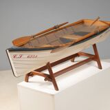 Boat-shaped coffee table reimagined with a glass top, contemporary design (after 2000)