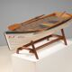 Boat-shaped coffee table reimagined with a glass top, contemporary design (after 2000)