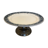 Earthenware display on metal pedestal