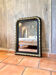 Louis-Philippe black and gold antique mirror from the 19th century.