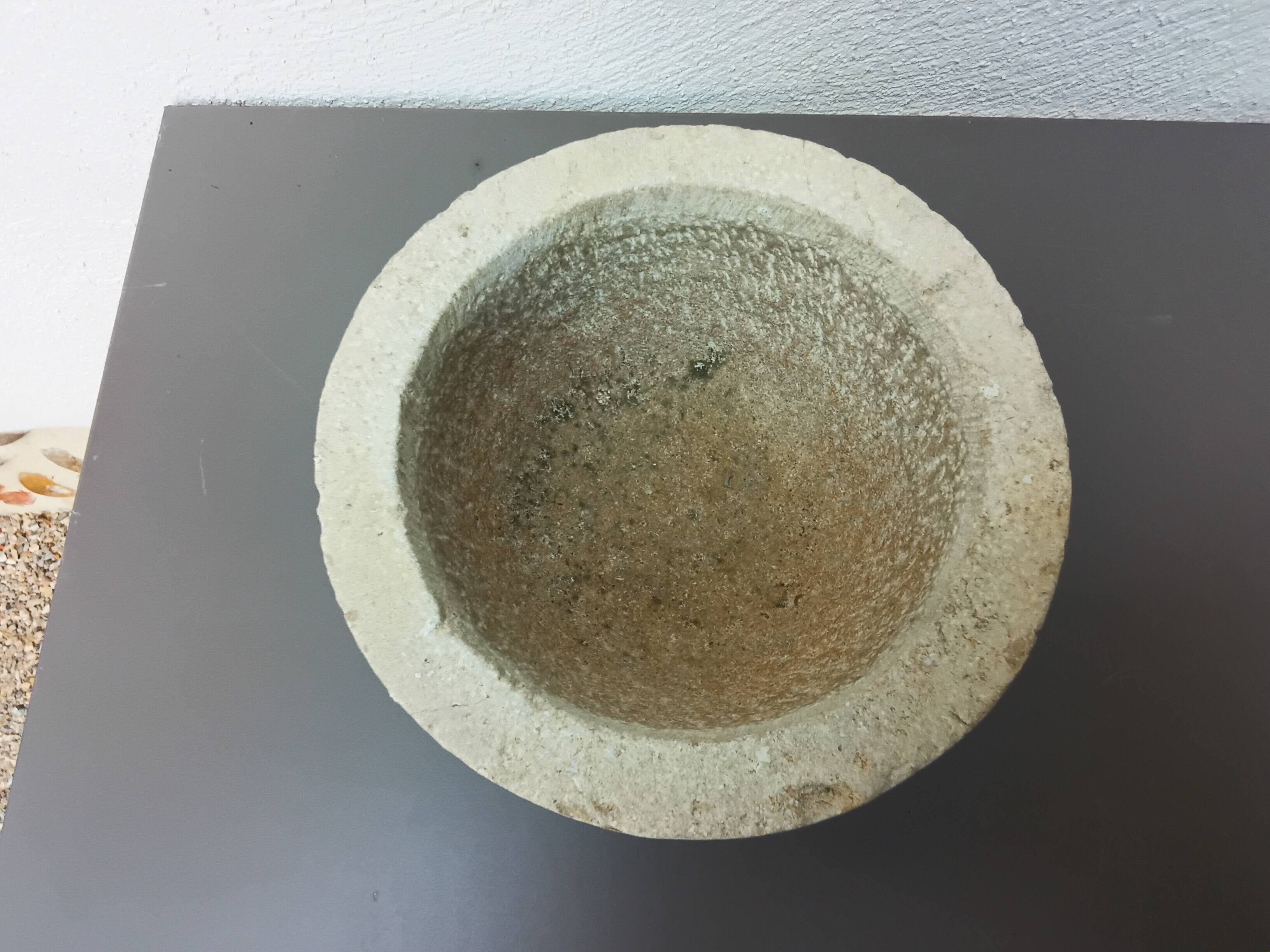 Stone mortar with wooden pestle