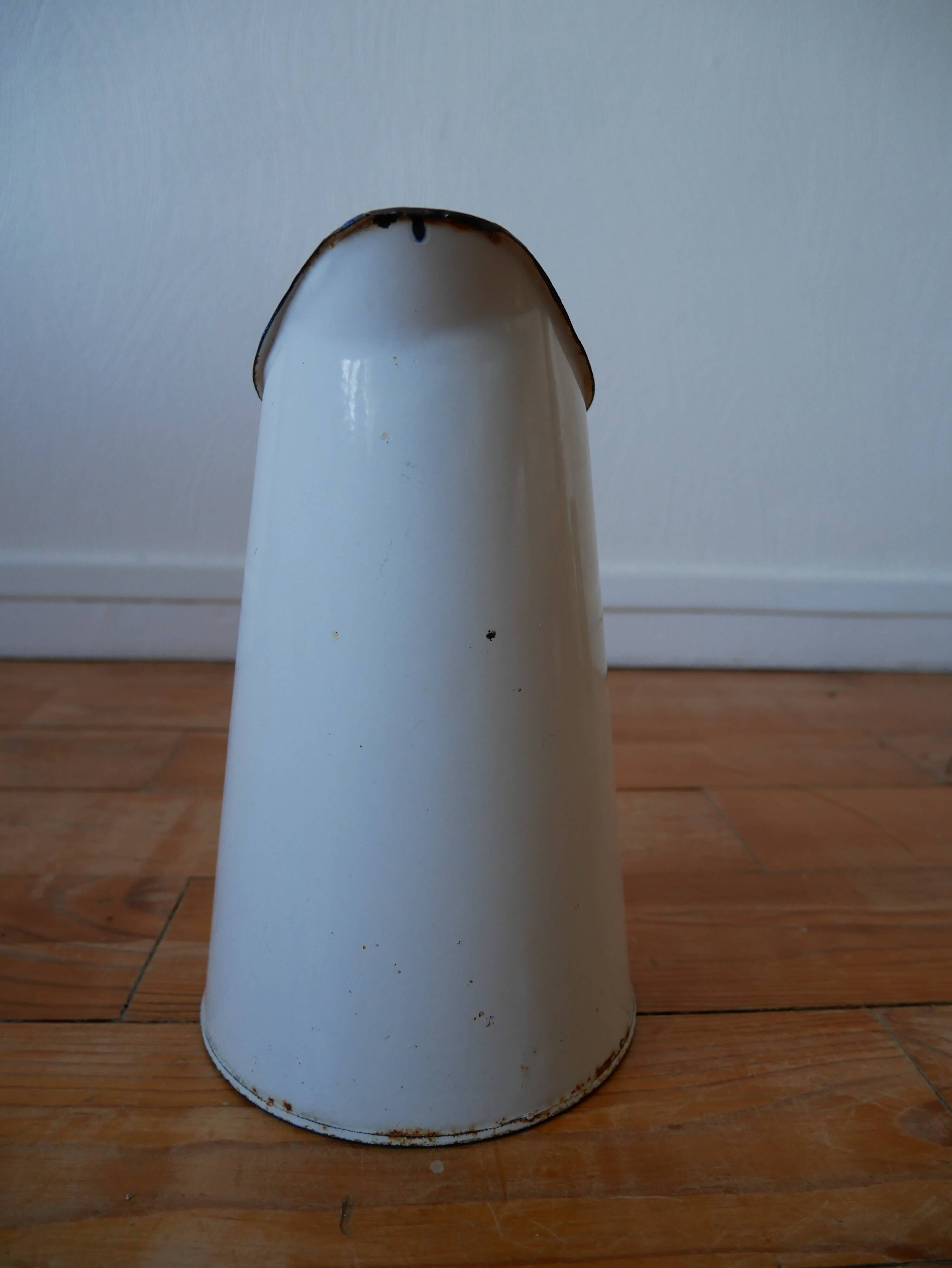 White enamelled metal broc