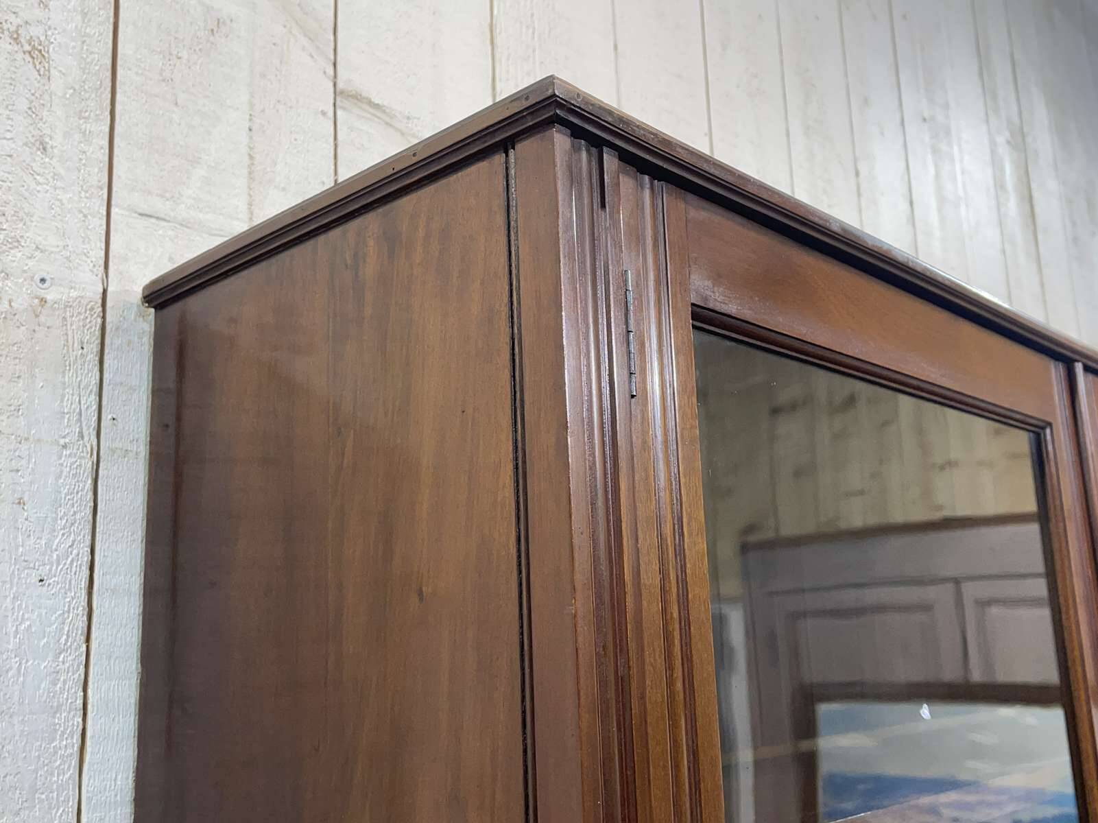 English walnut two-body library from the early 20th century.