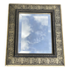 Bevelled mirror from the 19th century with gold and black palmettes.