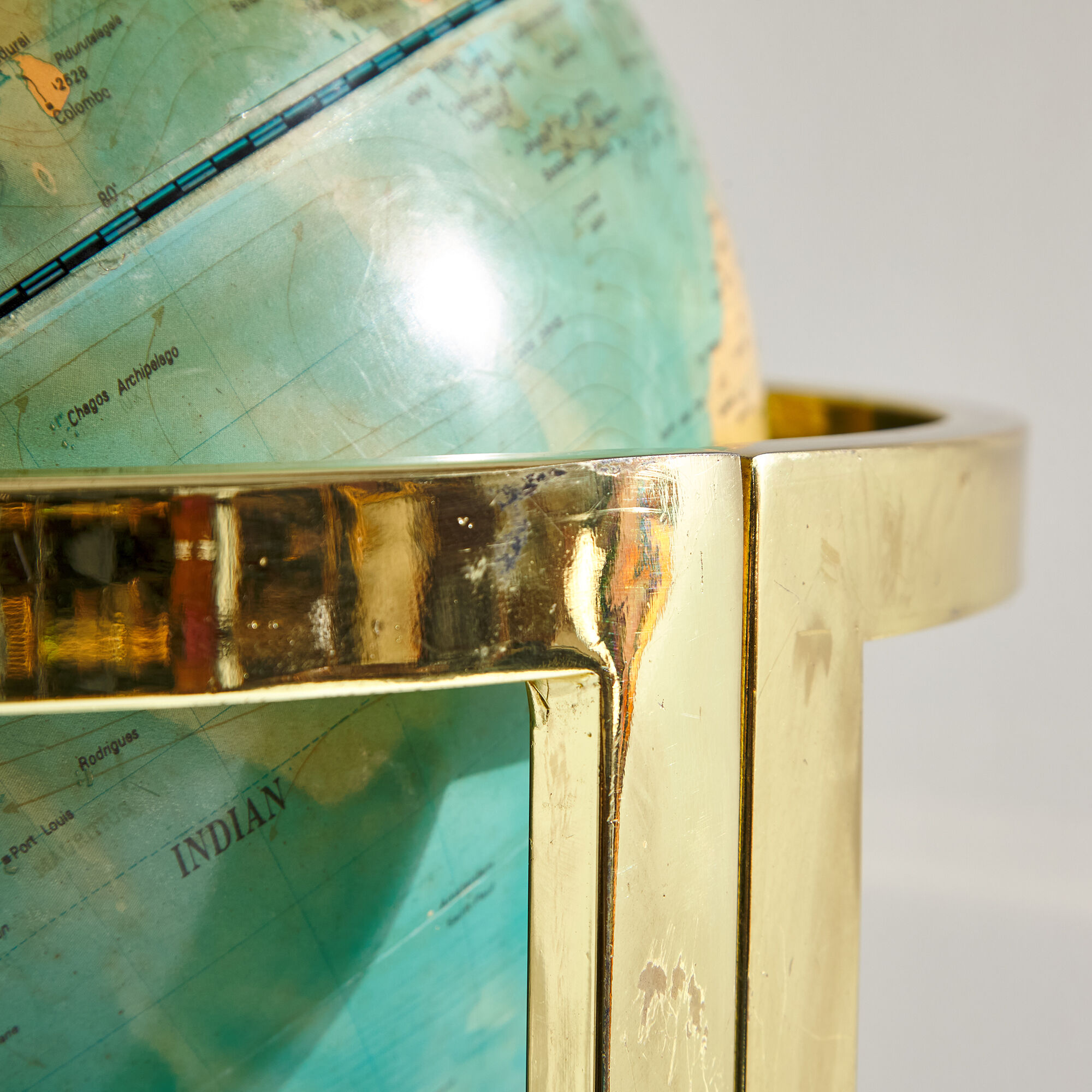 Illuminated globe on brass frame, 1980s