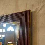 Mirror in wood and brass