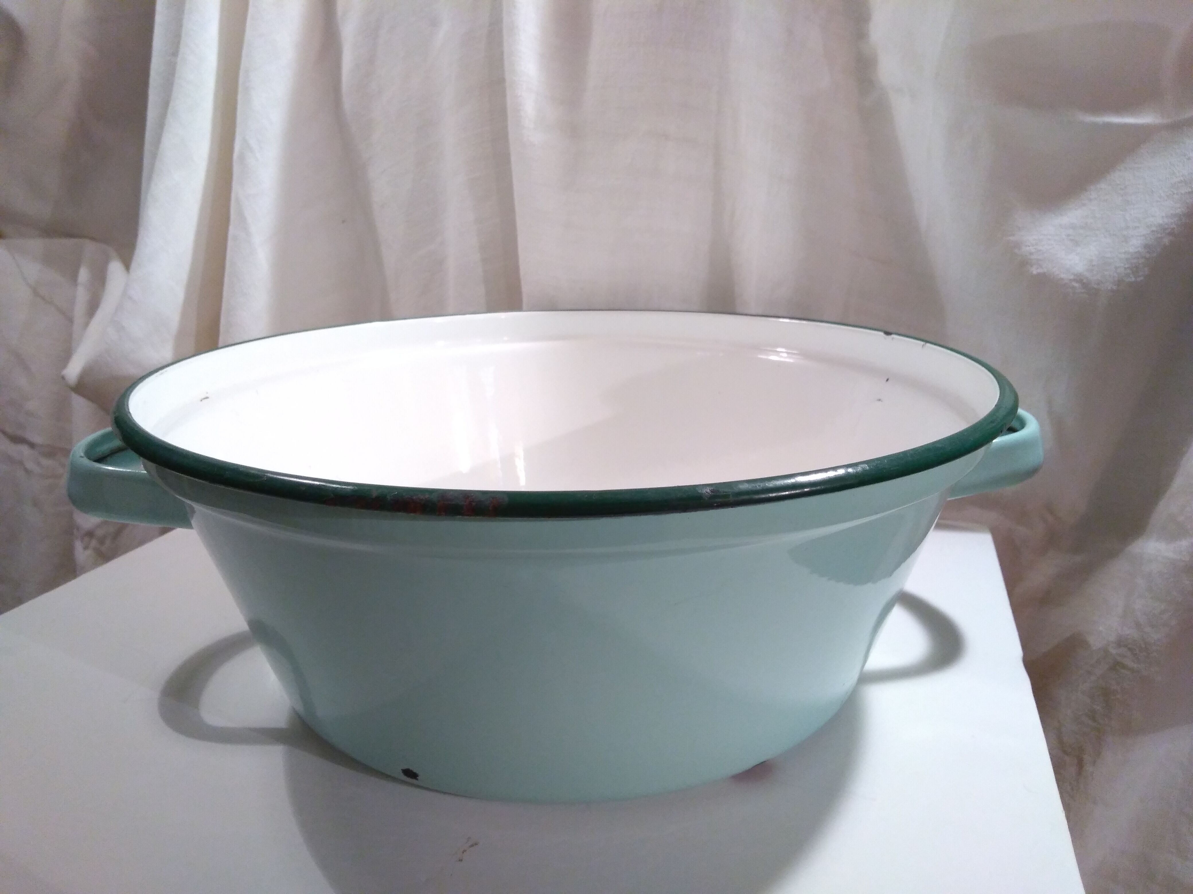 Ancient enamelled sheet metal basin