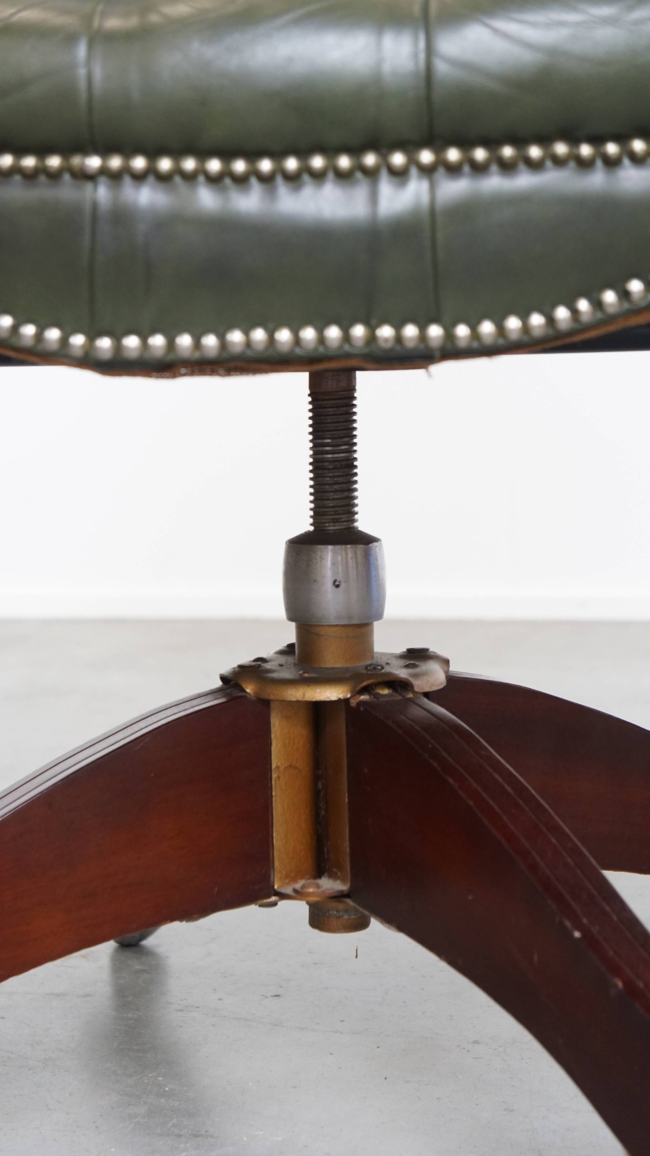 Chesterfield office chair in green cowhide leather on casters with high back