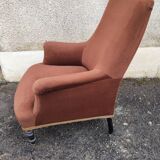 Antique brown velvet tub chair – turned legs and brass rings.