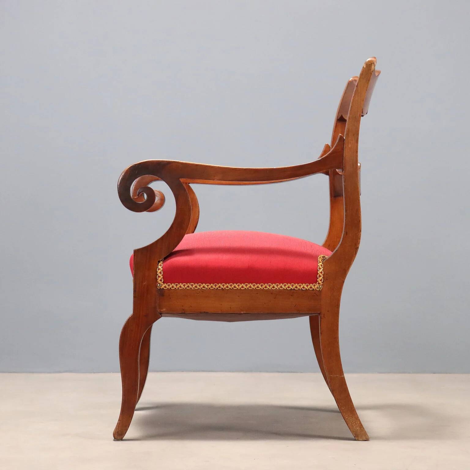 Antique Restoration-style armchair in walnut, fabric, Italy, 19th century.