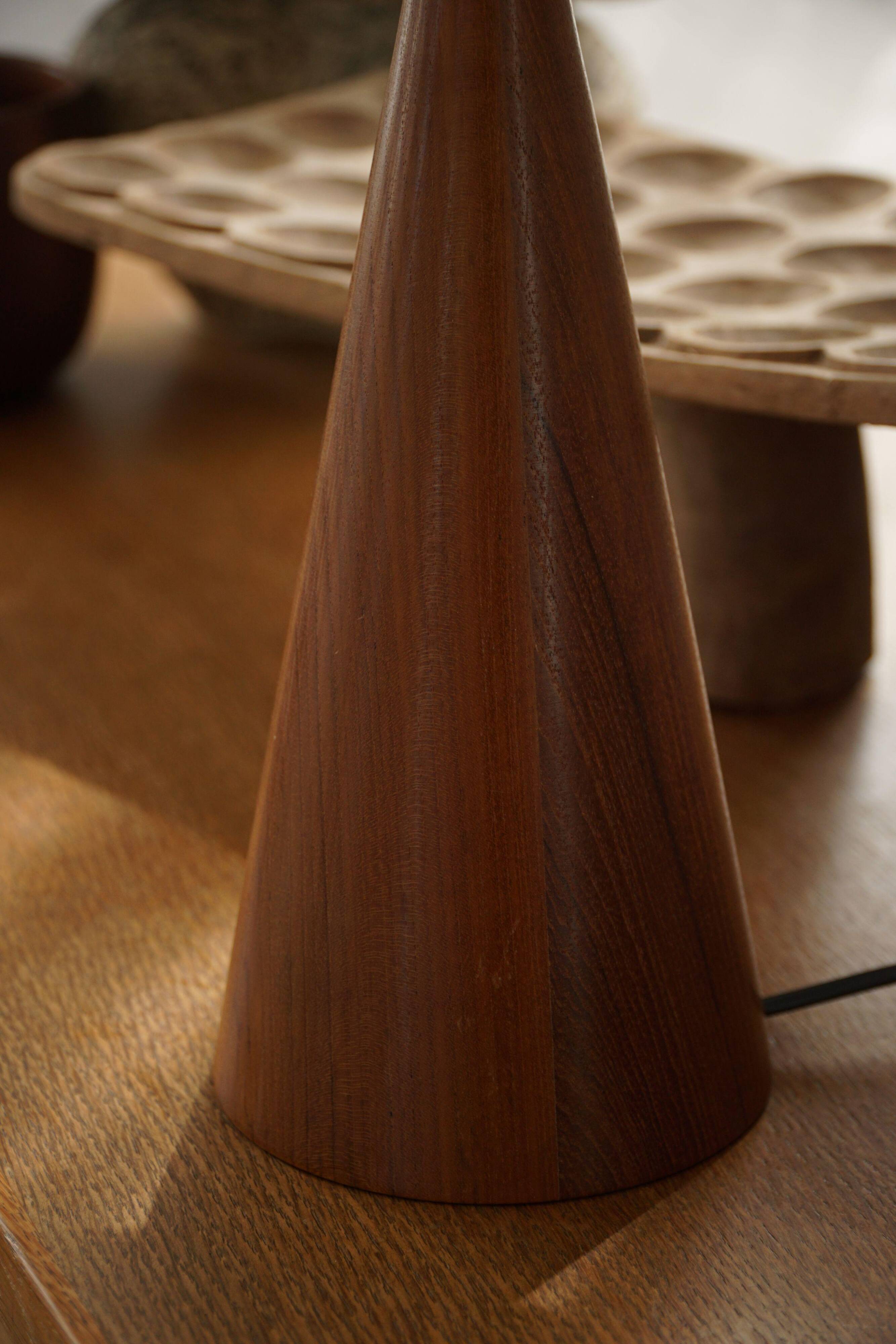 Modern Danish, a conical table lamp in teak, 1980s.