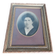 Old photo portrait framed in wood and stucco