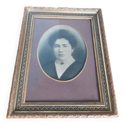 Old photo portrait framed in wood and stucco