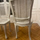 Set of 4 white caned chairs in Louis XV style.