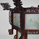 Asian wooden lantern carved with dragons and painted glass panels