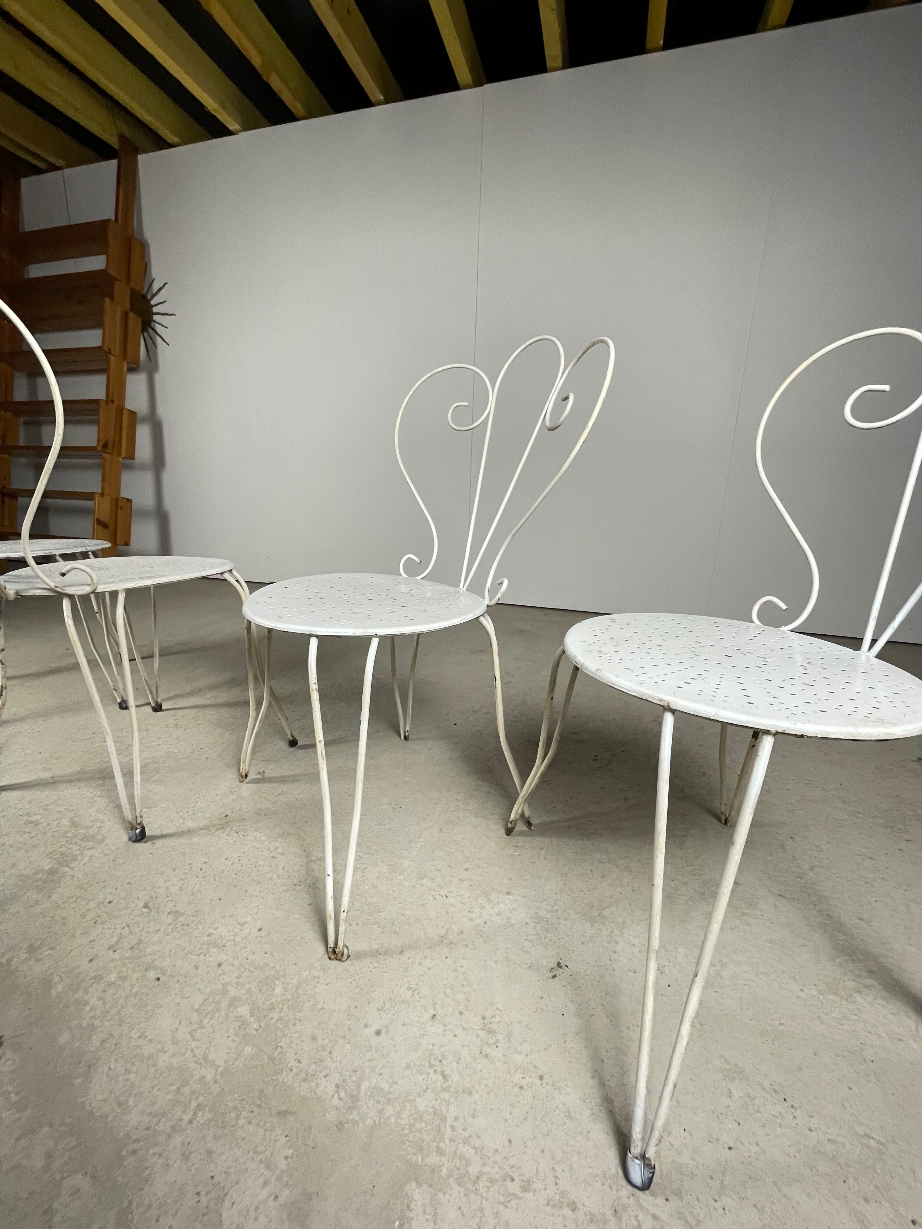 4 vintage wrought iron chairs