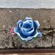 Old barbotine candle holder in the shape of a rose