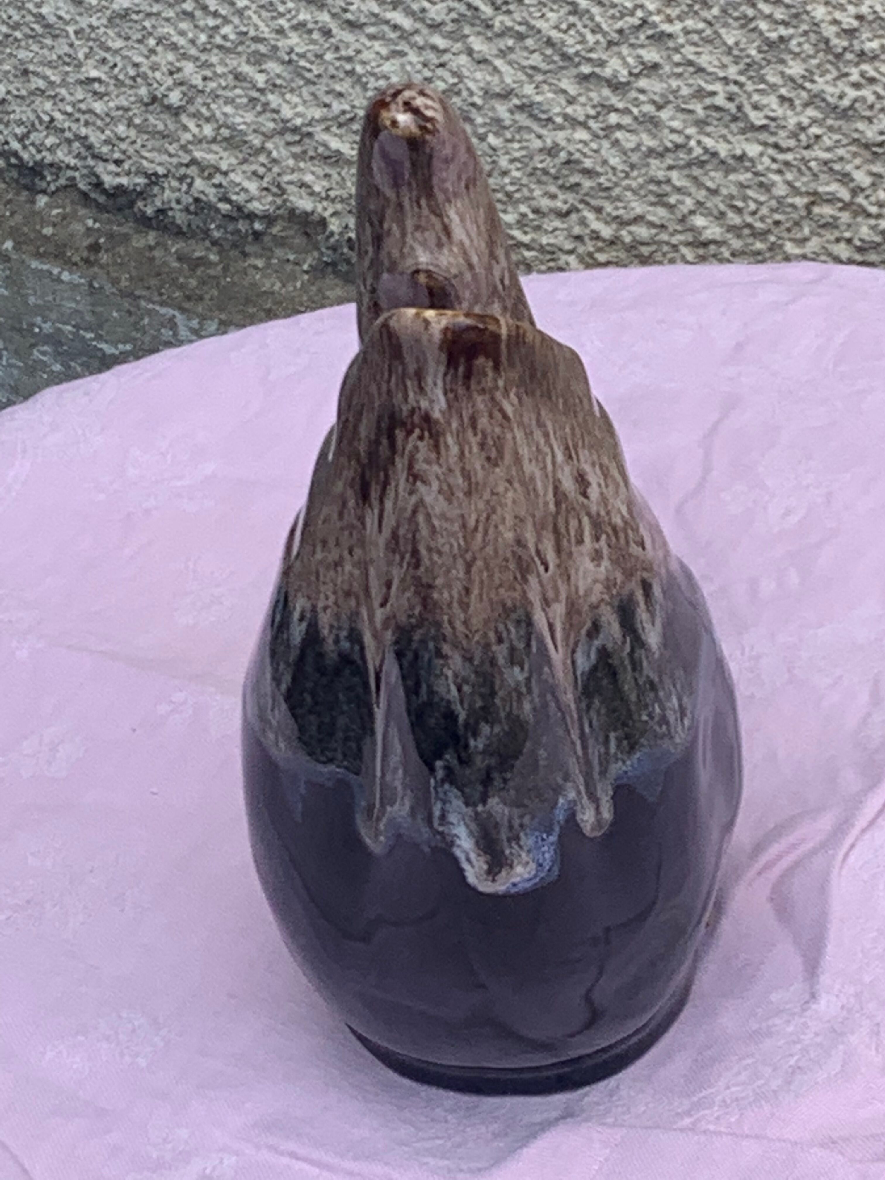 Vintage and numbered glazed ceramic decanter