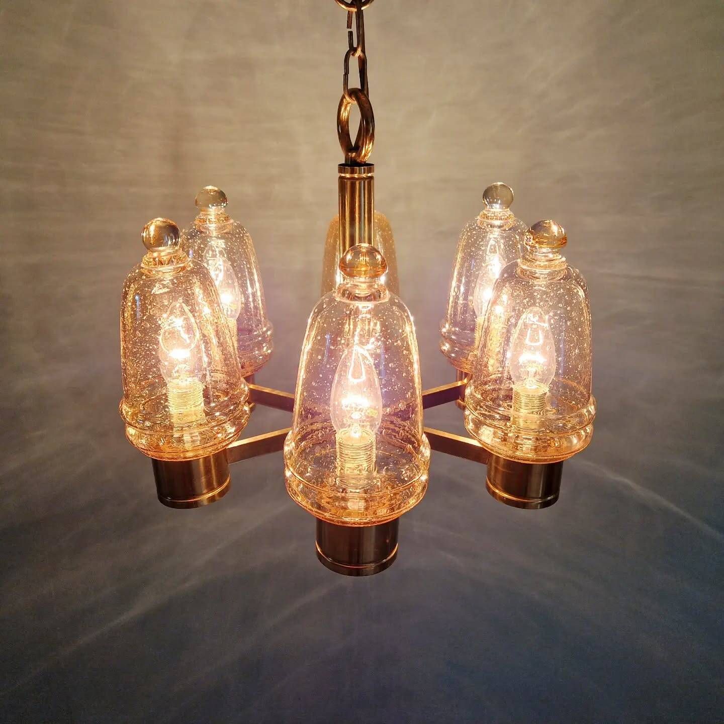 Brass chandelier with amber bubbled glass globes, 1970.