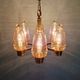 Brass chandelier with amber bubbled glass globes, 1970.