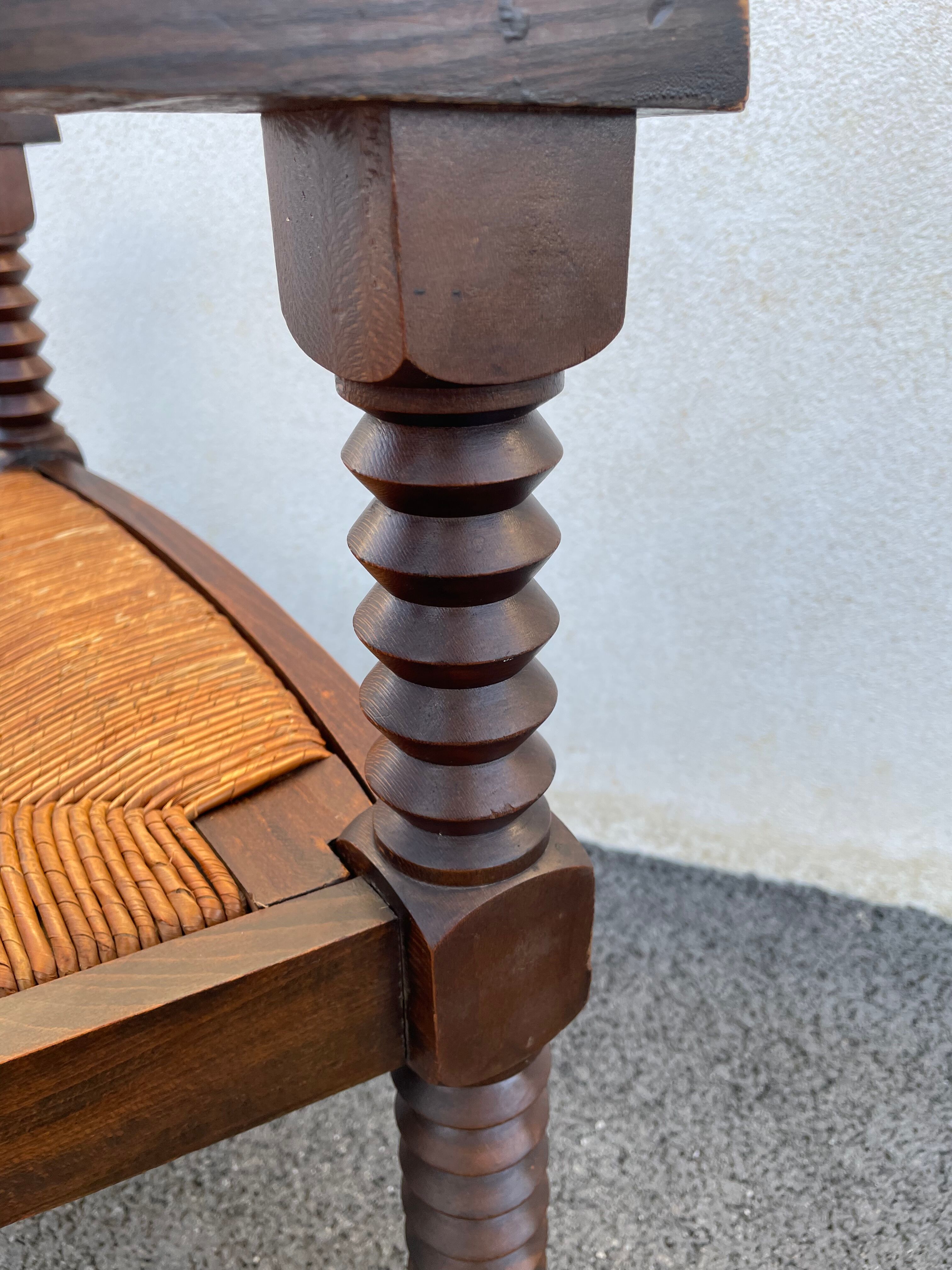 Vintage armchair in straw and brutalist wood